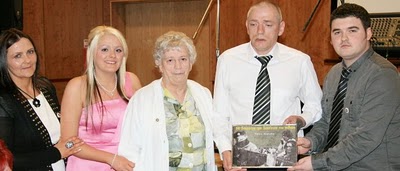 Click on image to see full-sized version Barry McColgan making presentation to family of Paula Murphy