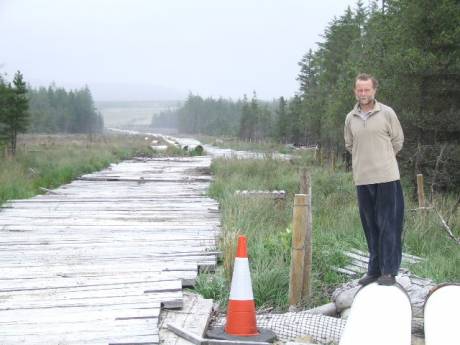 Click on image to see full-sized version Der Holland surveys the proposed pipeline route.