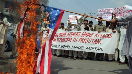 Click on image to see full-sized version Pakistani protesters belonging to United Citizen Action march behind a burning US flag during a protest in Multan on September 30, 2013, against the US drone attacks in Pakistani tribal areas (AFP Photo / S.S Mirza)